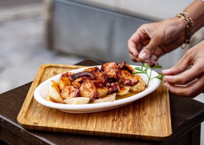 Happy diners enjoying tapas on the terrace at Iber&Co