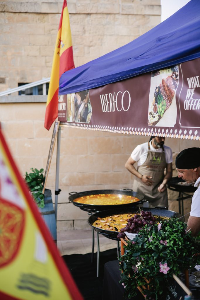 Iber&Co team serving paella at Fort St Angelo during the Malta International Fireworks Festival