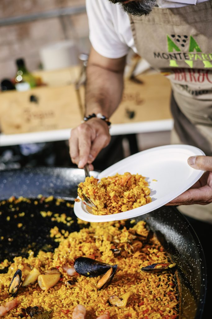 Iber&Co team serving paella at Fort St Angelo during the Malta International Fireworks Festival