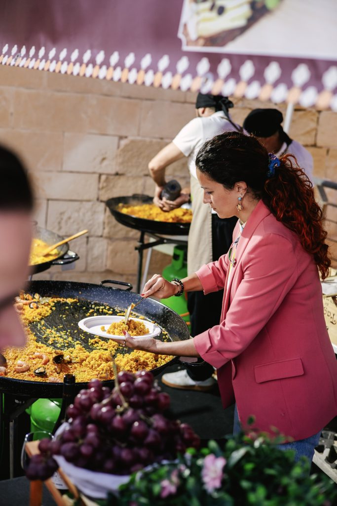 Iber&Co team serving paella at Fort St Angelo during the Malta International Fireworks Festival