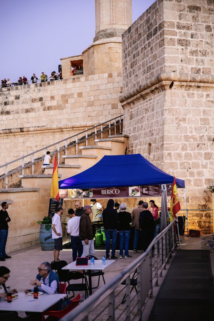Iber&Co team serving paella at Fort St Angelo during the Malta International Fireworks Festival