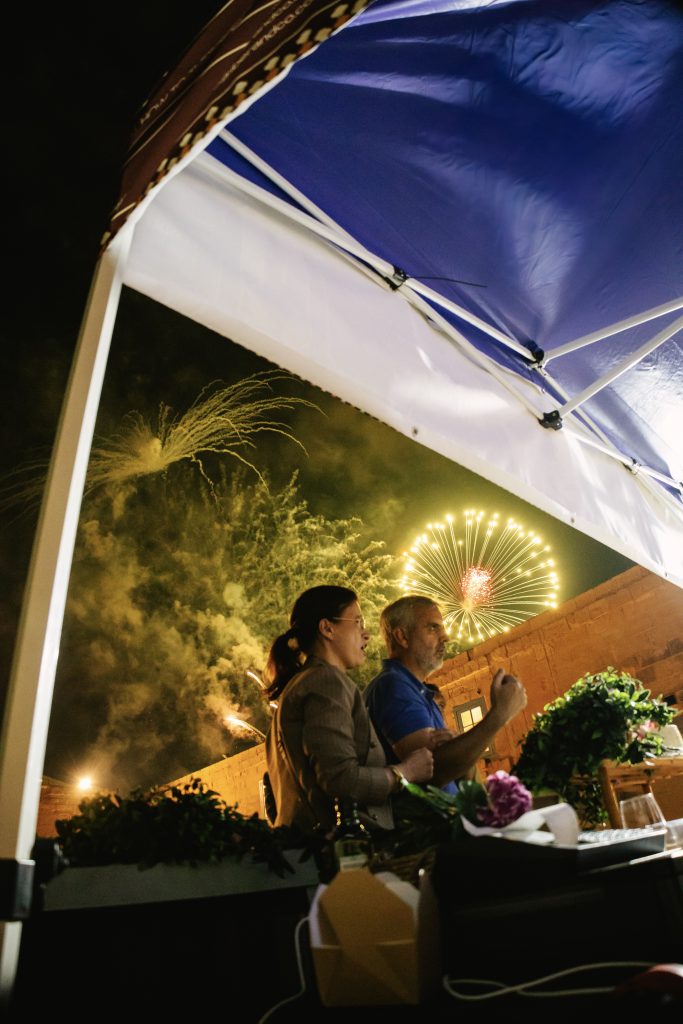 Iber&Co team serving paella at Fort St Angelo during the Malta International Fireworks Festival