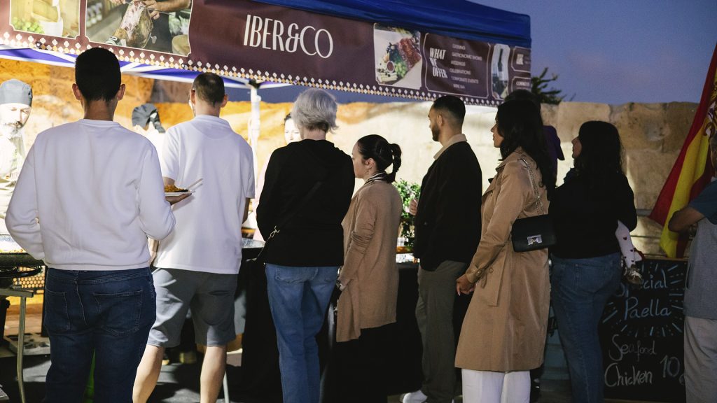 Iber&Co team serving food at a public event in Malta
