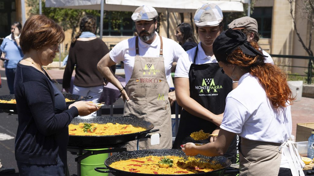 Students and families enjoying a Spanish paella event organised by Iber&Co in Malta