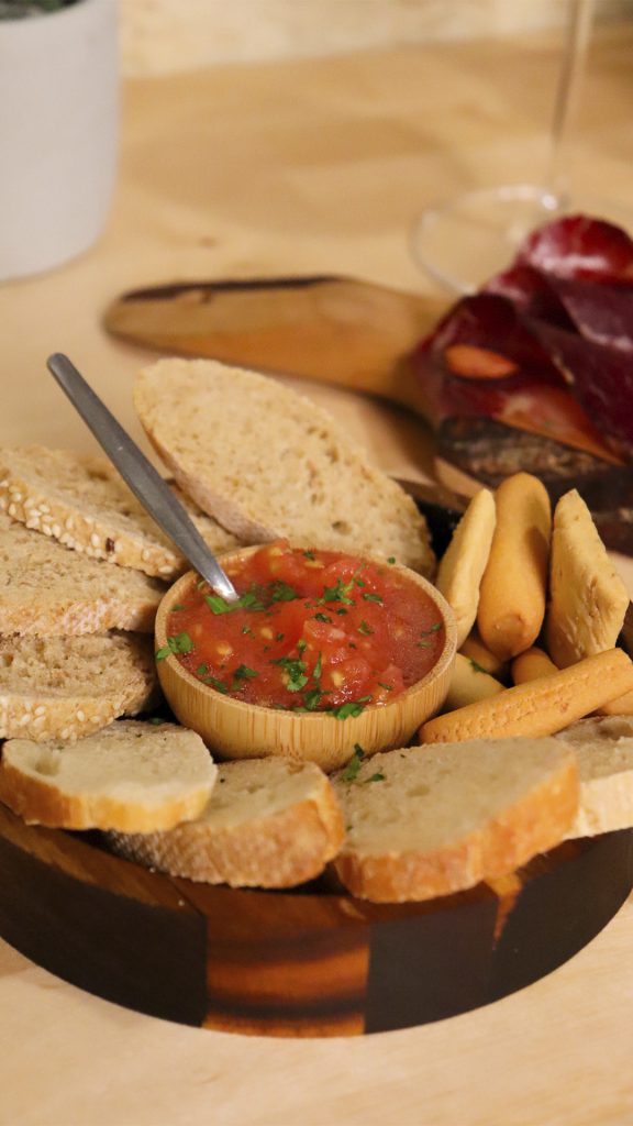 Guests enjoying a traditional Spanish tapas experience at Iber&Co